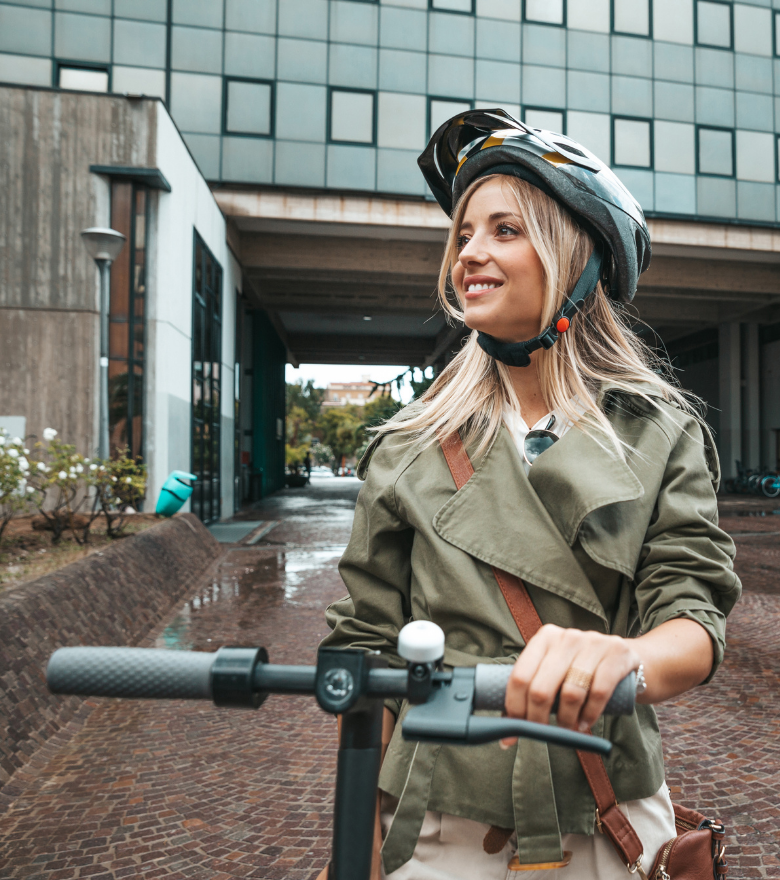 Girl riding electric scooter | Featured image for Buying an E Scooter – Electric Scooter Buying Guide